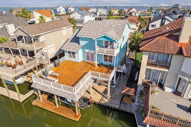 1022 Long Reach Dr, Tiki Island, TX 77554 - aerial perspective of suburban area with a nearby body of water