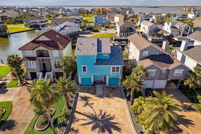 1022 Long Reach Dr, Tiki Island, TX 77554 - aerial view of residential area featuring a nearby body of water