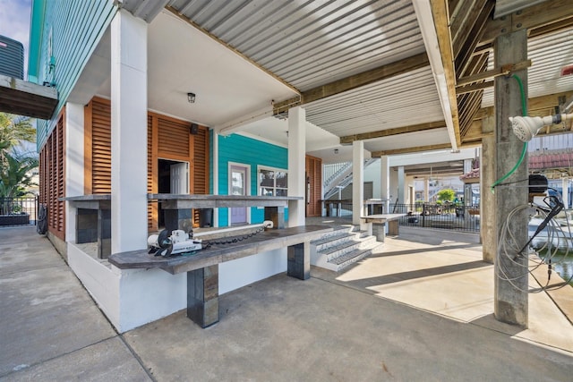 1022 Long Reach Dr, Tiki Island, TX 77554 - view of patio / terrace with fence, an outdoor kitchen, and stairs