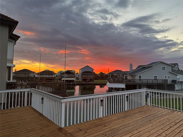 1022 Long Reach Dr, Tiki Island, TX 77554 - deck at dusk with a water view and a residential view
