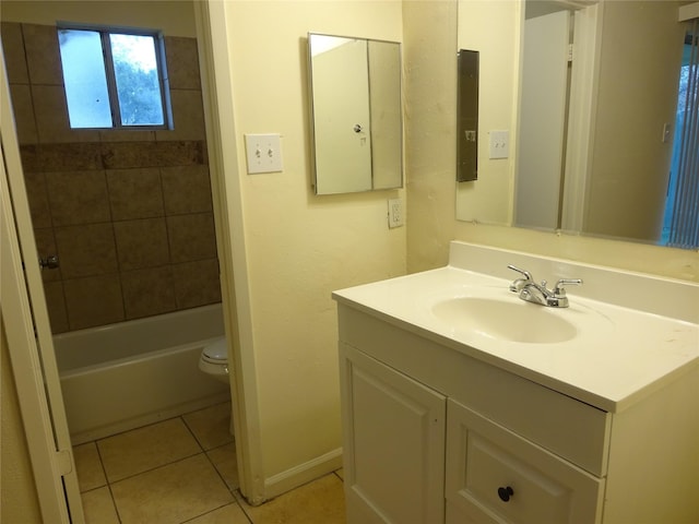 18506 Lippizaner Dr, Cypress, TX 77433 - bathroom with toilet, vanity, tile patterned floors, baseboards, and bathtub / shower combination