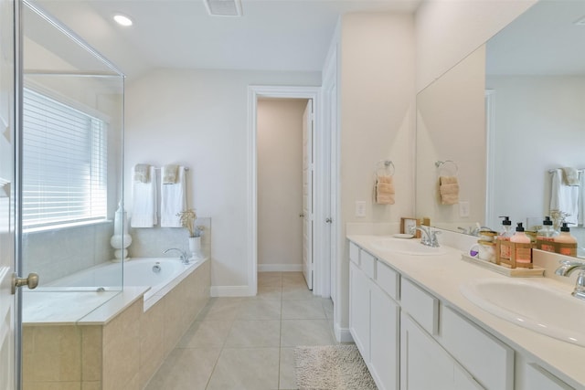 8902 Jasper Lake Dr, Cypress, TX 77433 - full bath with double vanity, a garden tub, and tile patterned floors