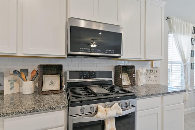 8902 Jasper Lake Dr, Cypress, TX 77433 - kitchen with stainless steel appliances, white cabinetry, backsplash, and stone counters