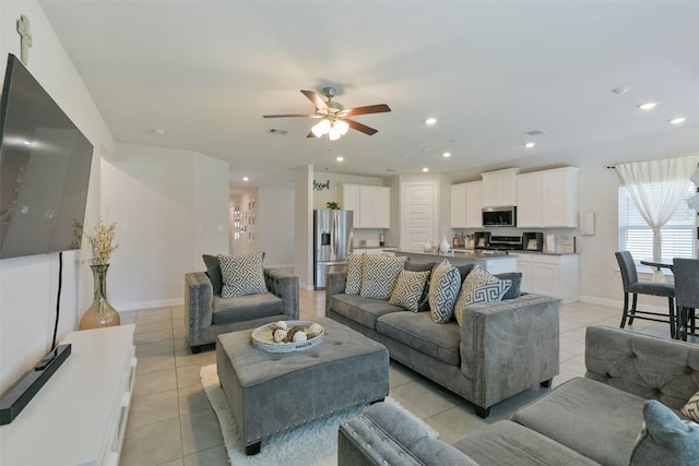 8902 Jasper Lake Dr, Cypress, TX 77433 - living room with light tile patterned floors, ceiling fan, recessed lighting, and baseboards