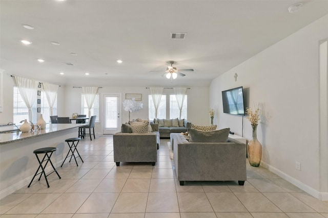 8902 Jasper Lake Dr, Cypress, TX 77433 - living area featuring baseboards, light tile patterned floors, ceiling fan, and recessed lighting
