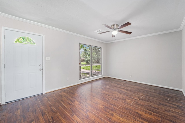 7433 Yoe St, Houston, TX 77016 - foyer entrance with plenty of natural light, dark wood-style flooring, crown molding, baseboards, and a ceiling fan