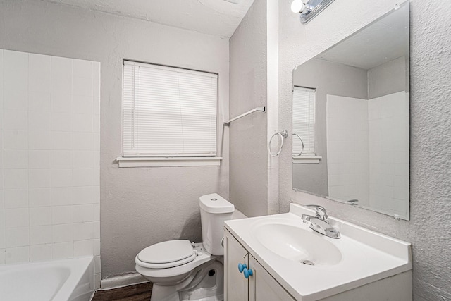 7433 Yoe St, Houston, TX 77016 - bathroom featuring a textured wall, wood finished floors, toilet, vanity, and shower / bath combination
