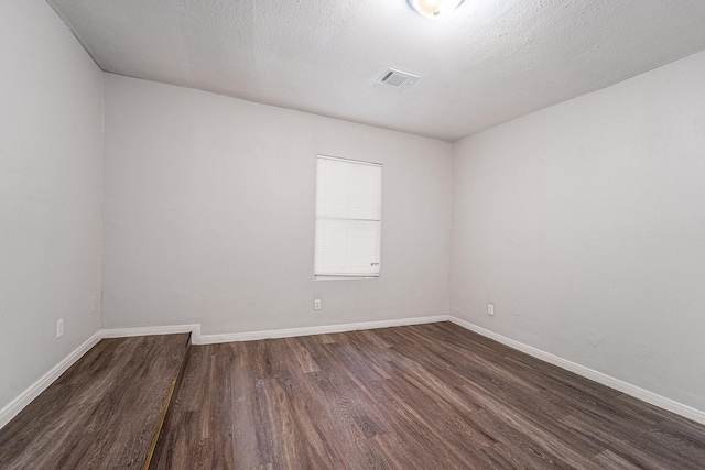 7433 Yoe St, Houston, TX 77016 - spare room with dark wood finished floors and baseboards
