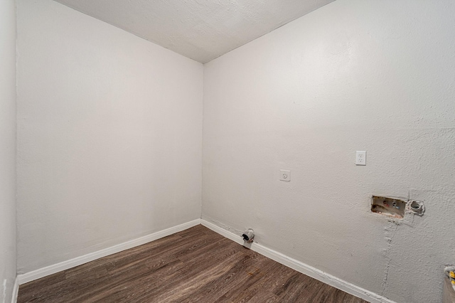 7433 Yoe St, Houston, TX 77016 - laundry room with dark wood-style flooring, baseboards, washer hookup, and electric dryer hookup