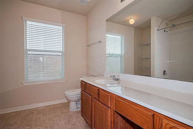 1526 Claremont Garden Cir, Houston, TX 77047 - bathroom with toilet, vanity, baseboards, and a shower