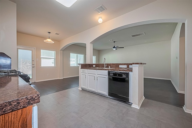 1526 Claremont Garden Cir, Houston, TX 77047 - kitchen featuring dishwasher, a sink, ceiling fan, white cabinets, and tile patterned flooring