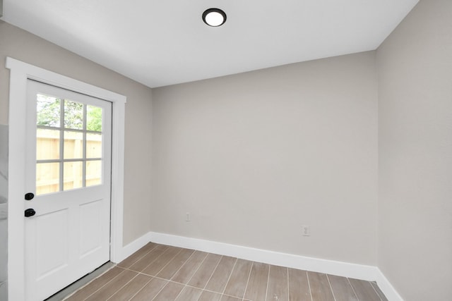 5903 Belneath St, Houston, TX 77033 - doorway to outside with baseboards and wood finished floors