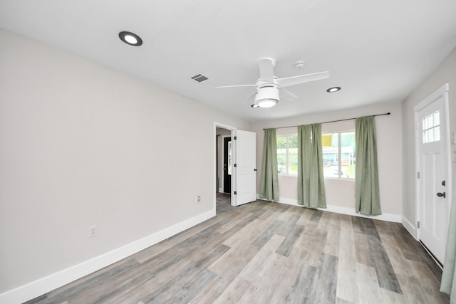 5903 Belneath St, Houston, TX 77033 - spare room featuring plenty of natural light, baseboards, recessed lighting, and light wood-style floors