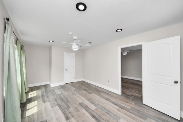 5903 Belneath St, Houston, TX 77033 - spare room featuring ceiling fan, baseboards, wood finished floors, and recessed lighting