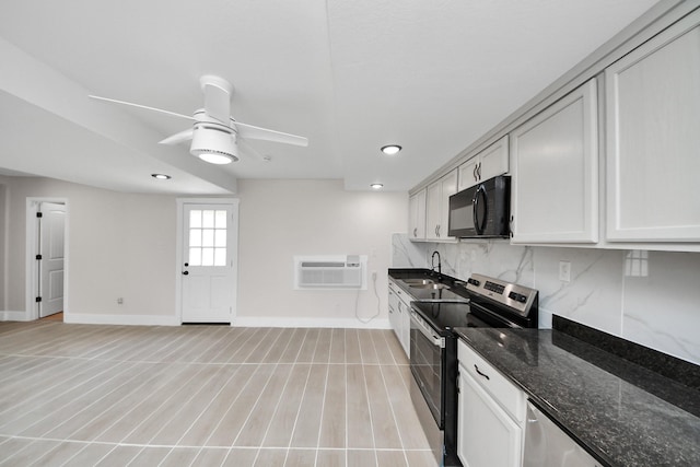 5903 Belneath St, Houston, TX 77033 - kitchen with electric range, black microwave, baseboards, tasteful backsplash, and ceiling fan