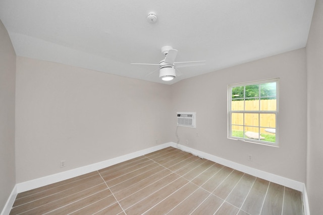 5903 Belneath St, Houston, TX 77033 - spare room with ceiling fan, baseboards, and a wall mounted air conditioner