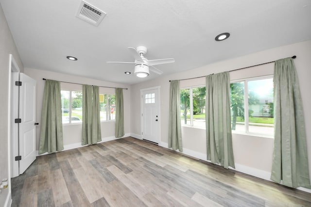 5903 Belneath St, Houston, TX 77033 - foyer entrance with plenty of natural light, baseboards, a ceiling fan, wood finished floors, and recessed lighting