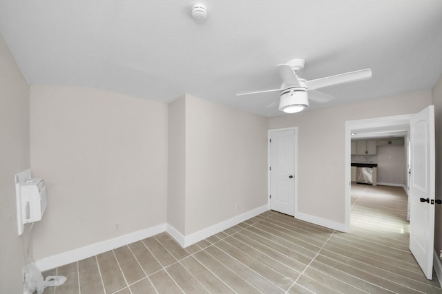 5903 Belneath St, Houston, TX 77033 - spare room with a ceiling fan, a smoke detector, and baseboards
