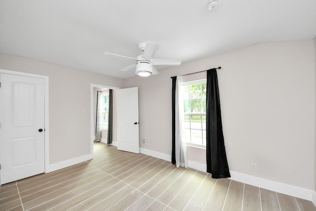 5903 Belneath St, Houston, TX 77033 - unfurnished bedroom with baseboards, light wood-type flooring, and a ceiling fan