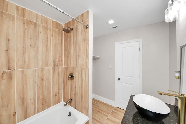 5903 Belneath St, Houston, TX 77033 - full bathroom featuring shower / tub combination and wood finished floors