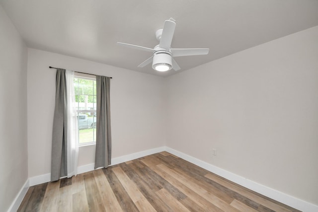 5903 Belneath St, Houston, TX 77033 - spare room featuring baseboards, light wood-type flooring, and ceiling fan