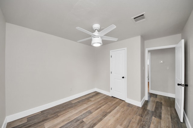 5903 Belneath St, Houston, TX 77033 - unfurnished bedroom featuring wood finished floors, baseboards, and ceiling fan