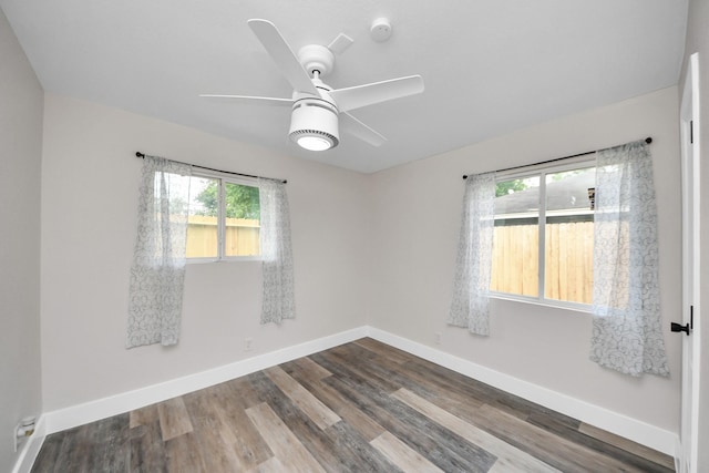 5903 Belneath St, Houston, TX 77033 - spare room with plenty of natural light, a ceiling fan, baseboards, and wood finished floors