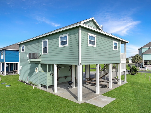 3229 Castle Dr, Crystal Beach, TX 77650 - back of property featuring cooling unit, a patio, and a lawn