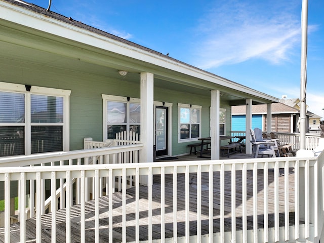 3229 Castle Dr, Crystal Beach, TX 77650 - wooden deck with a porch