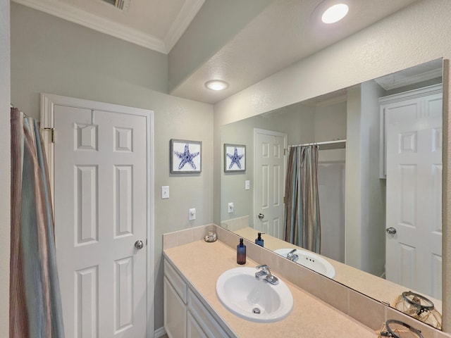3229 Castle Dr, Crystal Beach, TX 77650 - full bath with crown molding, vanity, and curtained shower