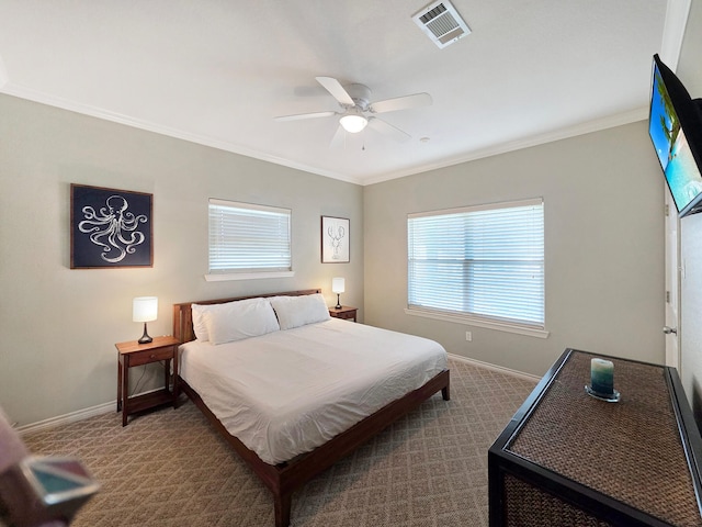 3229 Castle Dr, Crystal Beach, TX 77650 - carpeted bedroom with baseboards, crown molding, and a ceiling fan