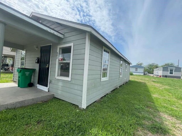 603 Willow St, Baytown, TX 77520 - view of home's exterior with a yard