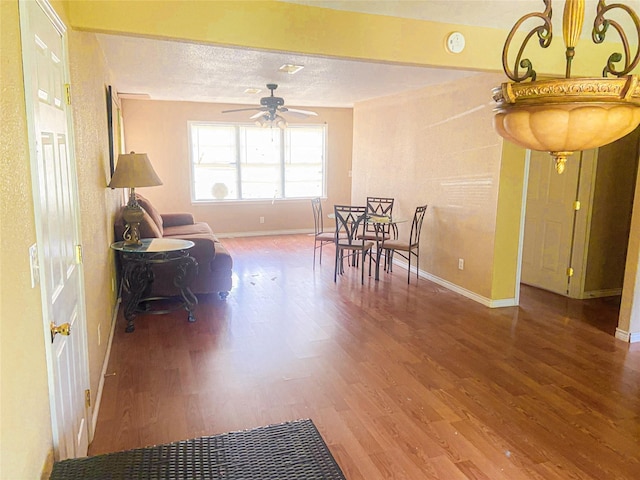 340 Warner St, Bridge City, TX 77611 - dining area featuring baseboards, wood finished floors, and ceiling fan