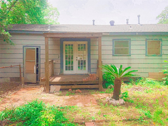 340 Warner St, Bridge City, TX 77611 - back of house with french doors and a shingled roof