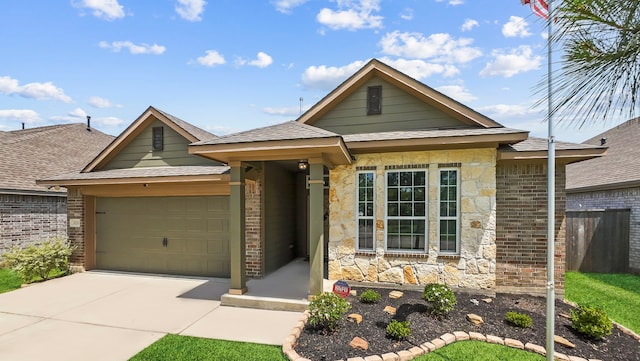 3221 Climbing Gardens Ct, Conroe, TX 77301 - view of front of property with an attached garage, driveway, brick siding, and roof with shingles
