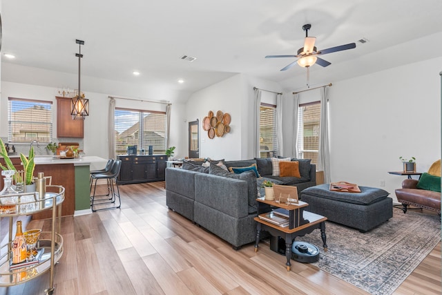 3221 Climbing Gardens Ct, Conroe, TX 77301 - living area featuring light wood finished floors, ceiling fan, and recessed lighting