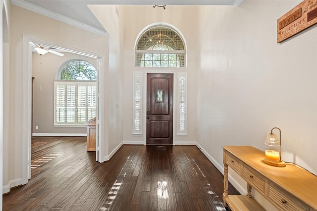 17726 Rough River Ct, Humble, TX 77346 - entrance foyer with dark wood-style floors, baseboards, crown molding, and ceiling fan