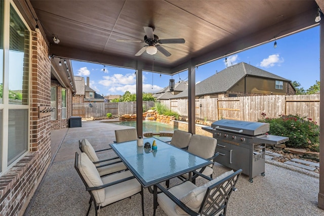 17726 Rough River Ct, Humble, TX 77346 - fenced backyard featuring a patio, grilling area, outdoor dining area, and ceiling fan