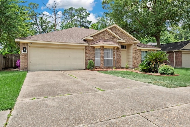 22711 Tree House Ln, Spring, TX 77373 - ranch-style house featuring brick siding, concrete driveway, a garage, and roof with shingles