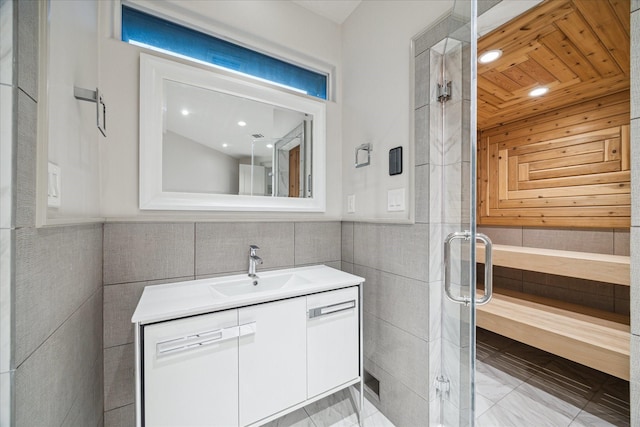 19 Ellicott Way, Sugar Land, TX 77479 - full bathroom featuring tile walls, a stall shower, marble finish flooring, vanity, and recessed lighting