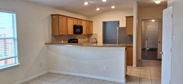 2902 Winslow Forest Ln, Houston, TX 77047 - kitchen featuring black microwave, tasteful backsplash, light tile patterned floors, a peninsula, and recessed lighting