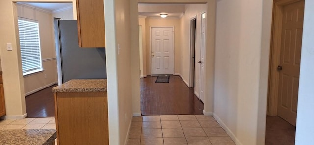 2902 Winslow Forest Ln, Houston, TX 77047 - hall featuring ornamental molding, light tile patterned flooring, and baseboards