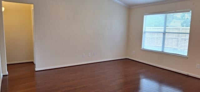 2902 Winslow Forest Ln, Houston, TX 77047 - empty room with wood finished floors, crown molding, healthy amount of natural light, and baseboards