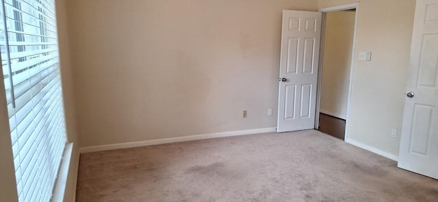 2902 Winslow Forest Ln, Houston, TX 77047 - unfurnished bedroom featuring light colored carpet and baseboards