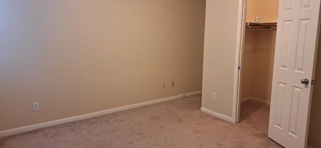 2902 Winslow Forest Ln, Houston, TX 77047 - unfurnished bedroom with light colored carpet, baseboards, and a closet