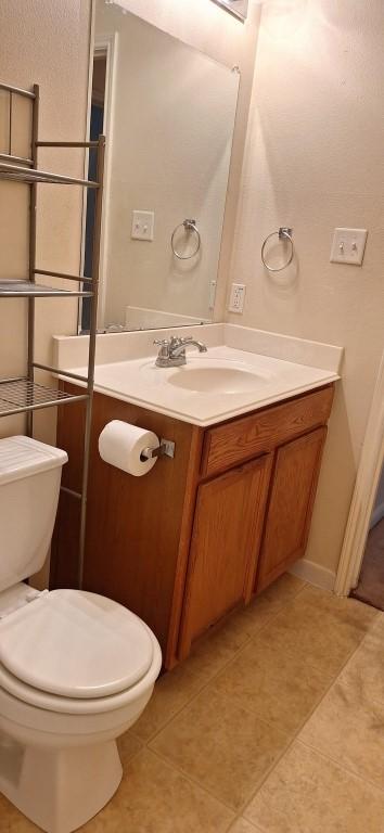 2902 Winslow Forest Ln, Houston, TX 77047 - half bath with vanity, toilet, and tile patterned flooring