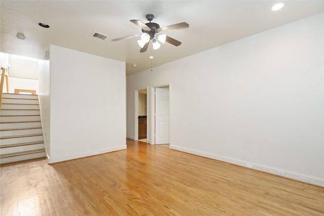 311 Gregg St, Houston, TX 77020 - unfurnished room with light wood-type flooring, ceiling fan, stairs, baseboards, and recessed lighting