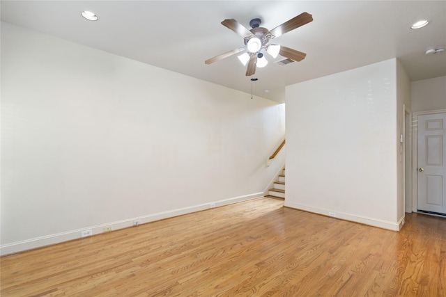 311 Gregg St, Houston, TX 77020 - empty room featuring light wood-type flooring, a ceiling fan, recessed lighting, baseboards, and stairs