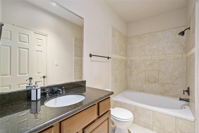 311 Gregg St, Houston, TX 77020 - bathroom with toilet, vanity, and tiled shower / bath
