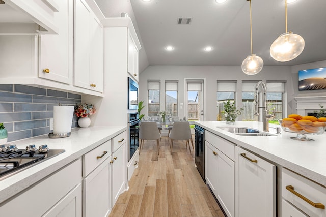 4107 Maple Glen Dr, Fulshear, TX 77441 - kitchen with a sink, stainless steel appliances, light countertops, white cabinetry, and recessed lighting